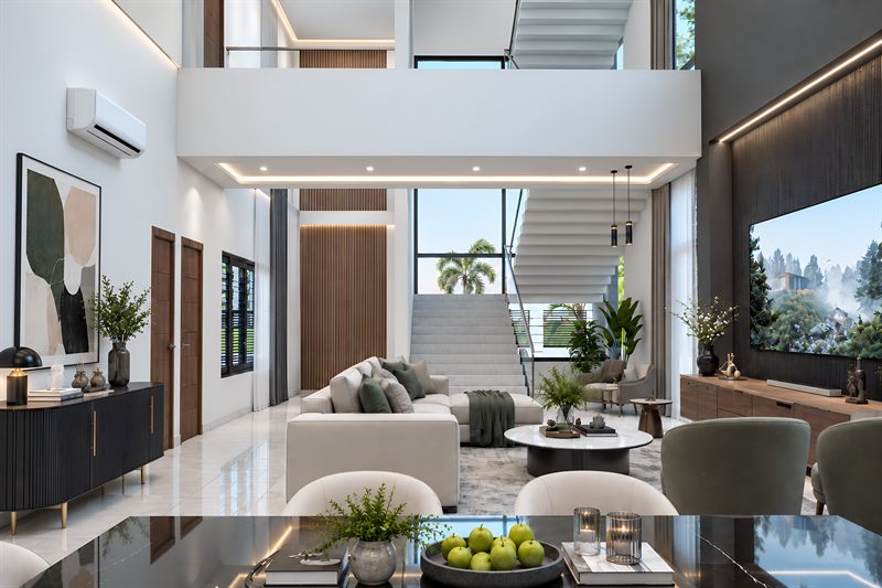 The double-height living room seen past the dining table: a stair rising to an upper walkway, a slatted timber panel on the left and full-height glazing to the garden.